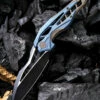 Flash Sale ✔️ We Knife Co. We Knife Arrakis Framelock Folder 906B, 3.45” Bohler M390 Black Wharncliffe Plain Blade, Blue and Bronze Stonewash Titanium Handle 👏