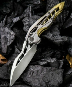 Deals 🌟 We Knife Co. We Knife Arrakis Framelock Folder 906C, 3.45” Bohler M390 Satin Wharncliffe Plain Blade, Gold and Gray Titanium Handle 🎁
