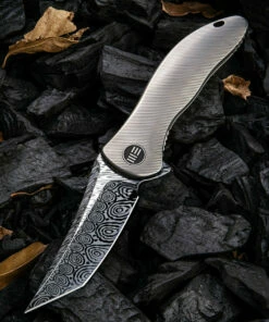 Outlet 🔥 We Knife Co. We Knife Synergy 2 Framelock Folder 912DS2, 3.49" Heimskringla Damasteel Tanto Plain Blade, 6AL4V Titanium Satin Polished Grooved Handle 🛒