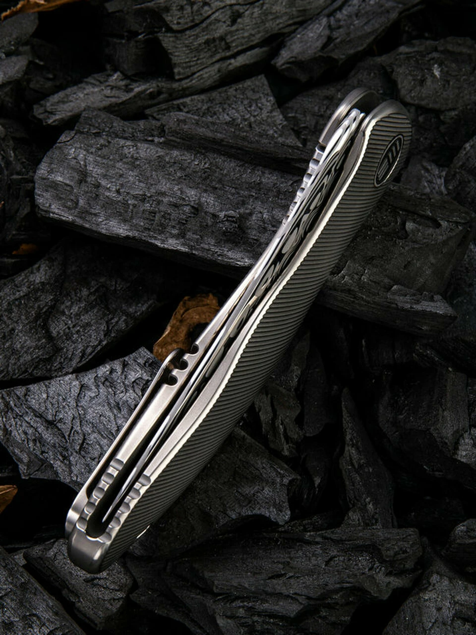 Cheap ๐ We Knife Co. We Knife Synergy 2 Framelock Folder 912DS1, 3.49" Heimskringla Damasteel Trailing Point Plain Blade, 6AL4V Titanium Satin Polished Grooved Handle ๐งจ 5 Cheap ๐ We Knife Co. We Knife Synergy 2 Framelock Folder 912DS1, 3.49" Heimskringla Damasteel Trailing Point Plain Blade, 6AL4V Titanium Satin Polished Grooved Handle ๐งจ - Image 5